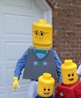 people dressed up as lego people (two kids and an adult).